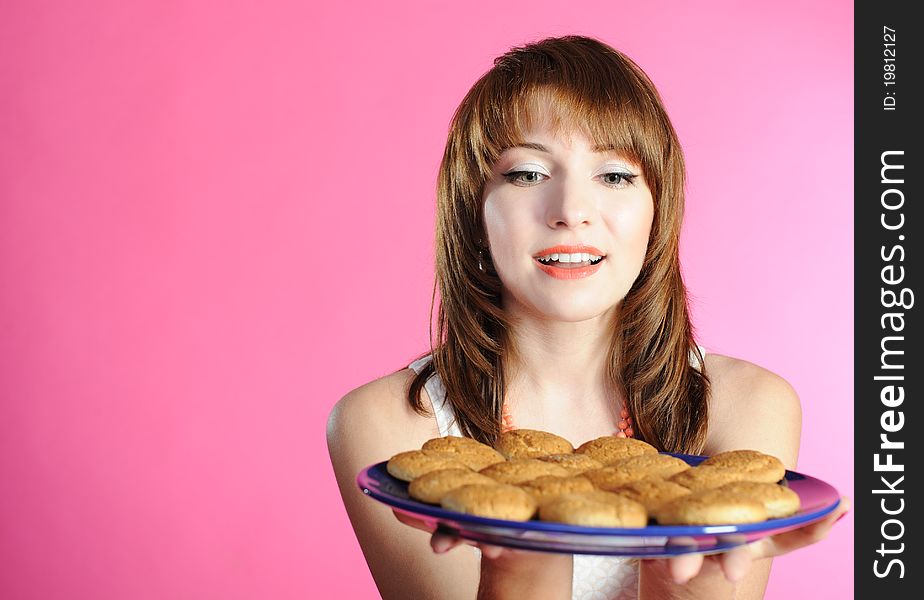 Young woman smelling cookies