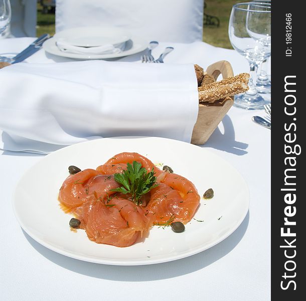 Gourme lunch with salmon in luxury mediterranean restaurant