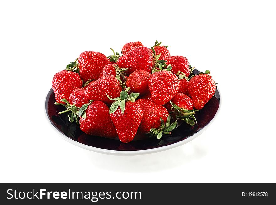 Tasty strawberry on a plate isolated on a white background