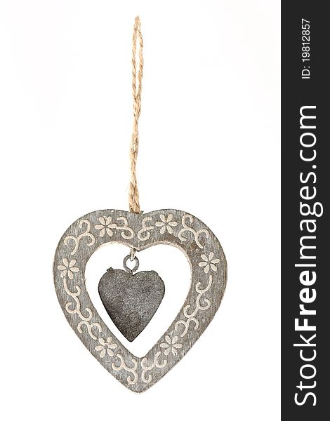 Beautiful wooden heart ornament hanging from a rope. Beautiful wooden heart ornament hanging from a rope