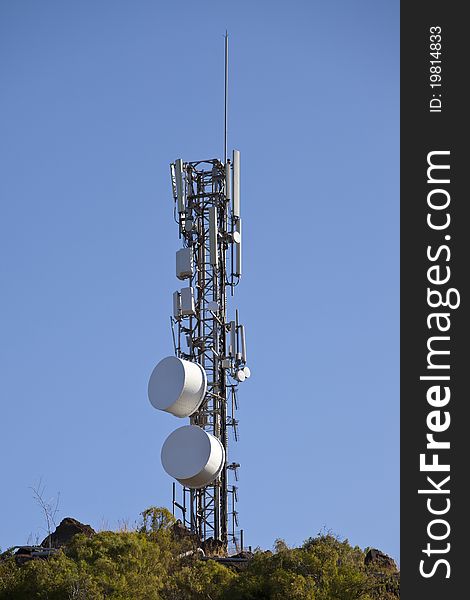 A telecommunication tower with antennas and dishes. A telecommunication tower with antennas and dishes