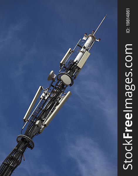 A telecommunication tower with antennas and dishes