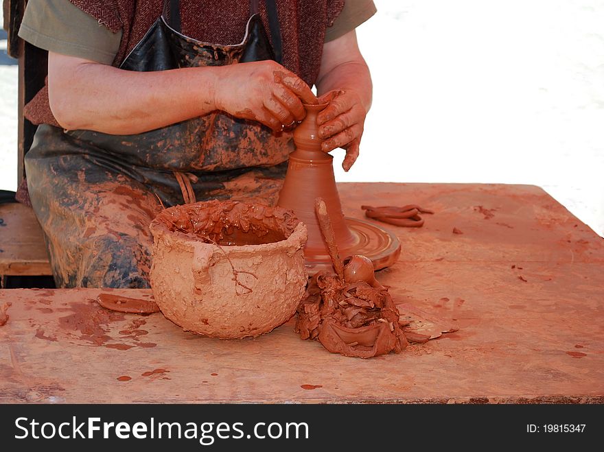Handwork pottery in a medieval market. Traditional pottery.