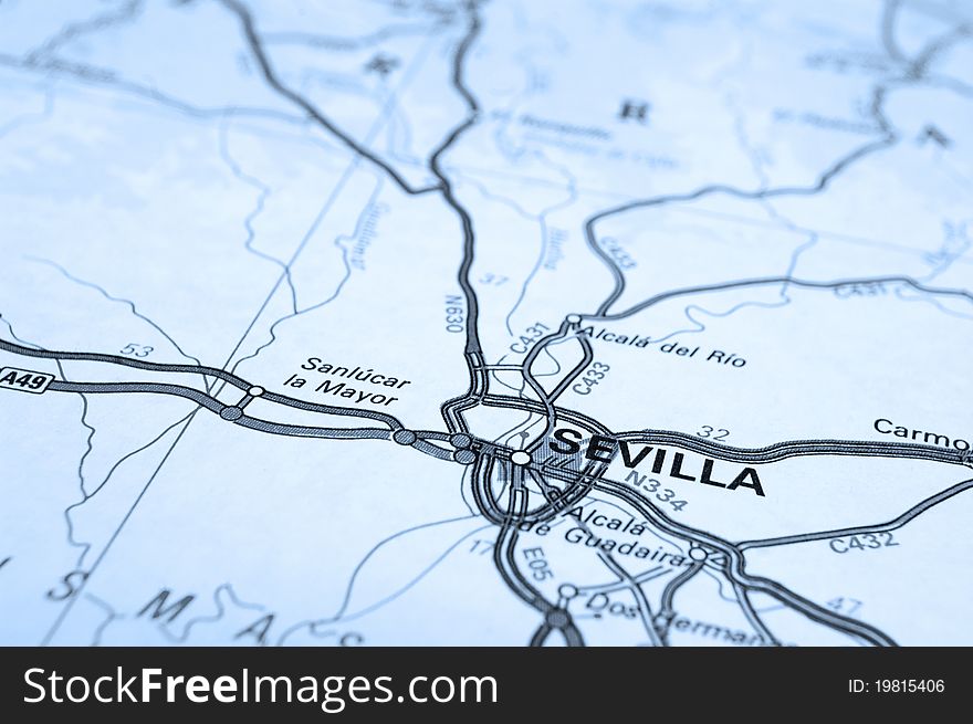 Macro of map showing Seville, Spain. Differential focus with shallow depth of field. Cool filter applied post production. Macro of map showing Seville, Spain. Differential focus with shallow depth of field. Cool filter applied post production.