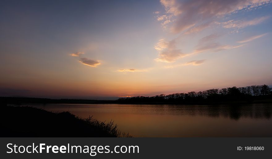 Panorama of sunset at the lake