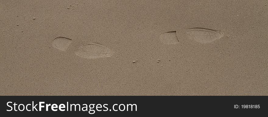 Shoe prints on smooth sand. Shoe prints on smooth sand