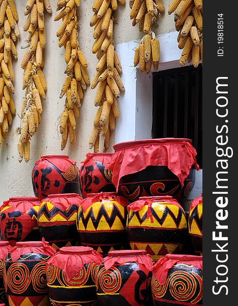 Featured drink pot with featured decorating pattern used in Chinese countryside, and hanging corn, which means lucky and rich home life. Featured drink pot with featured decorating pattern used in Chinese countryside, and hanging corn, which means lucky and rich home life.