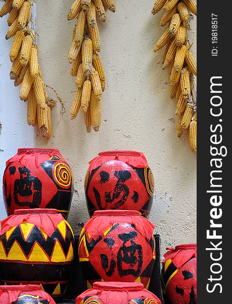 Featured drink pot with featured decorating pattern used in Chinese countryside, and hanging corn, which means lucky and rich home life. Featured drink pot with featured decorating pattern used in Chinese countryside, and hanging corn, which means lucky and rich home life.