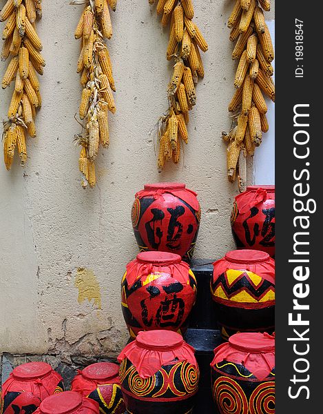 Featured drink pot with featured decorating pattern used in Chinese countryside, and hanging corn, which means lucky and rich home life. Featured drink pot with featured decorating pattern used in Chinese countryside, and hanging corn, which means lucky and rich home life.