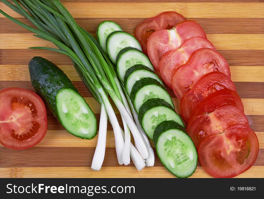 Sliced tomato, cucumber and onion. Sliced tomato, cucumber and onion