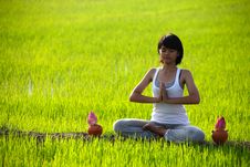 Girl Practicing Yoga,sitting With Lotus Flower Stock Photos