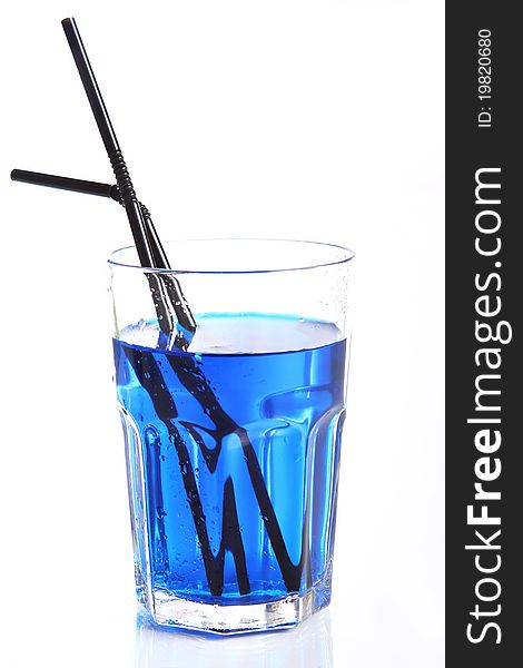 Glass with blue cocktail isolated on white