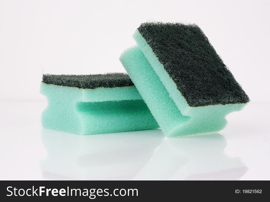 Green sponge isolated on a white background