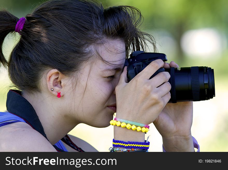Portrait of girl who is photographing. Portrait of girl who is photographing