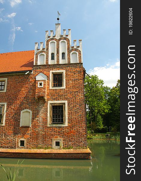 Renaissance-style palace surrounded by a moat. Renaissance-style palace surrounded by a moat