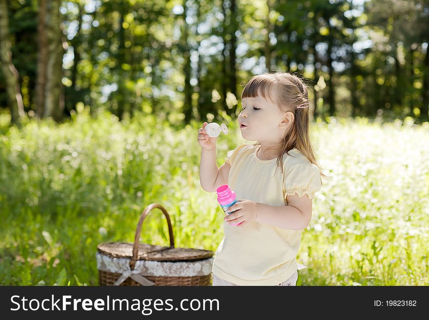 Small funny girl at the summer park. Small funny girl at the summer park