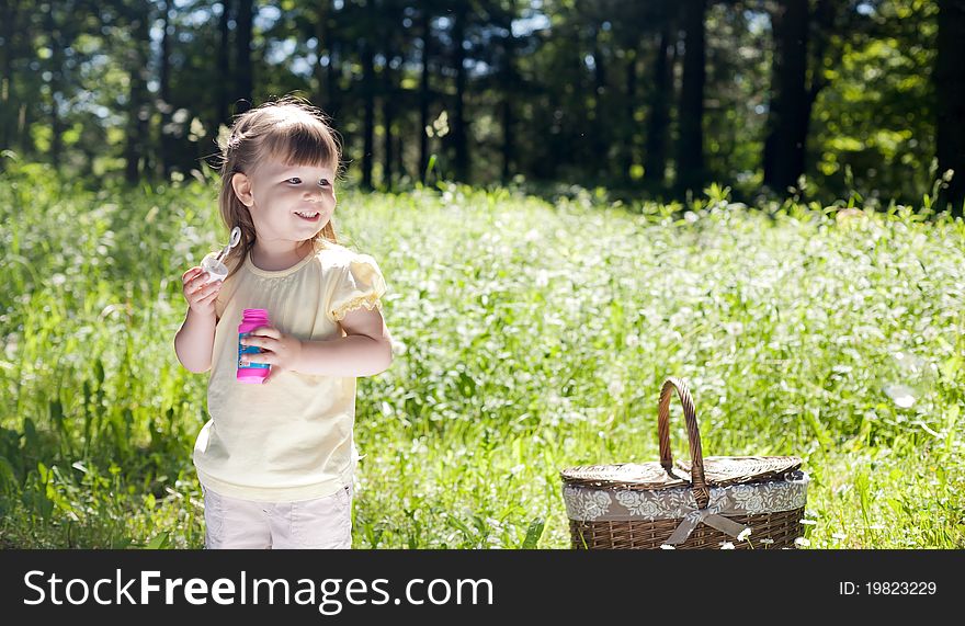 Small funny girl at the summer park. Small funny girl at the summer park