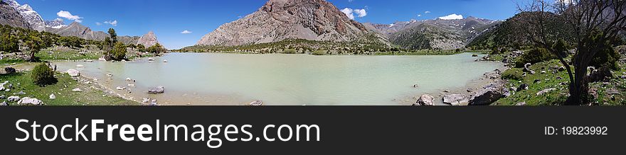 Mountain lake in background with high mountain