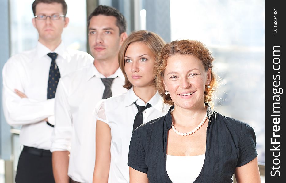 Group of officce workers posing for camera