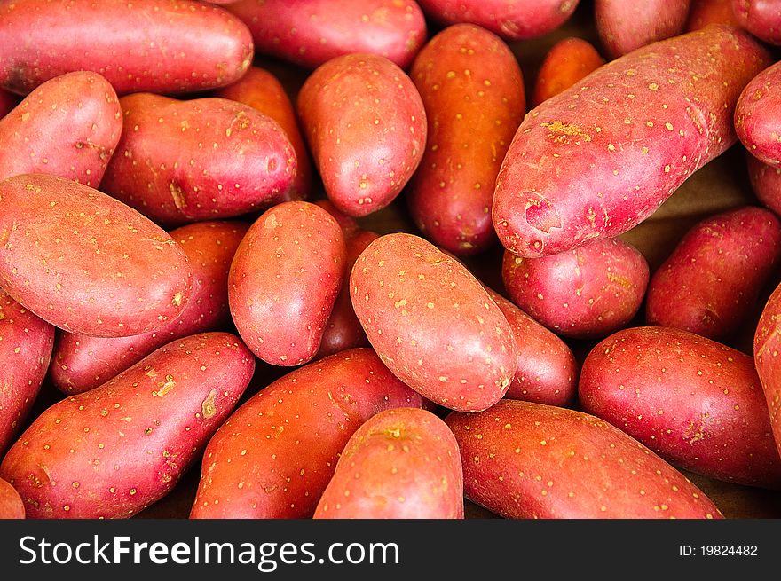 Pile of fresh red potatoes in a market