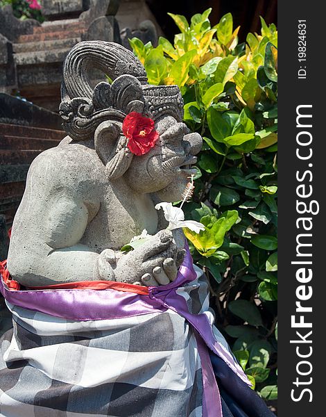 Demon statue in temple garden, Ubud, Bali, Indonesia