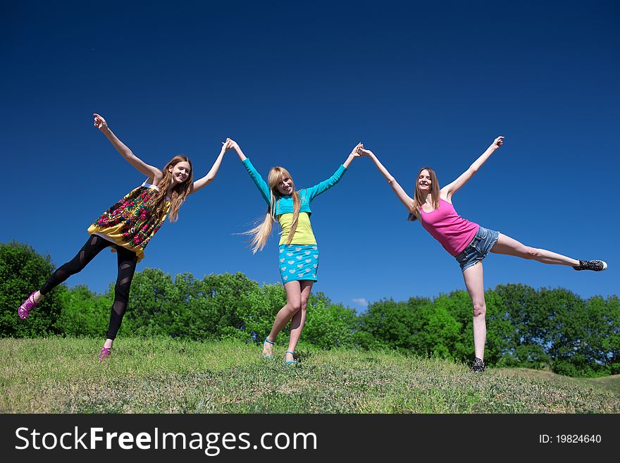 Group of young girls play and express positivity in park. Group of young girls play and express positivity in park