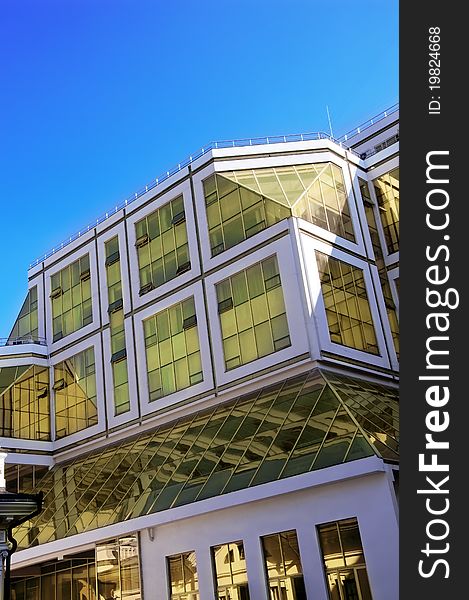 Picture of modern office building over blue sky