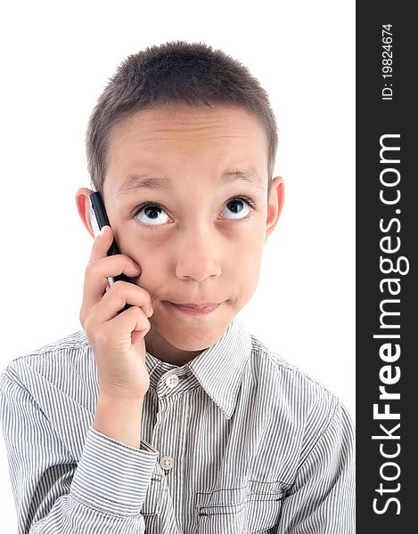 Young boy calling on the cellphone isolated on white. Young boy calling on the cellphone isolated on white