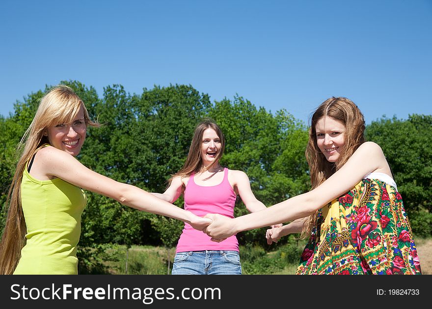 Group of young people play and express positivity in park. Group of young people play and express positivity in park