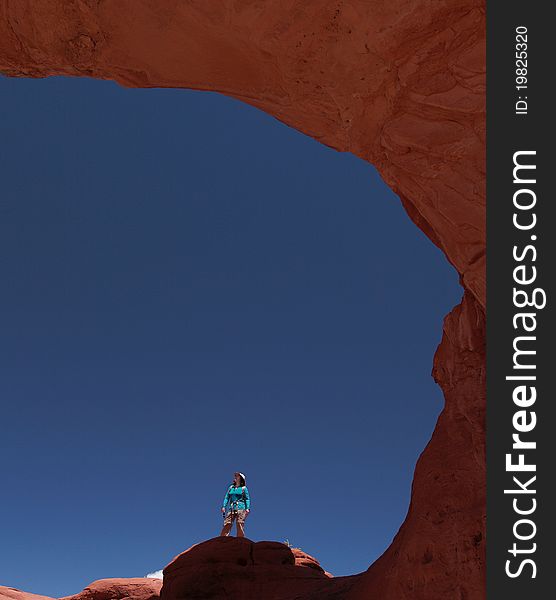 Woman And Sandstone Arch