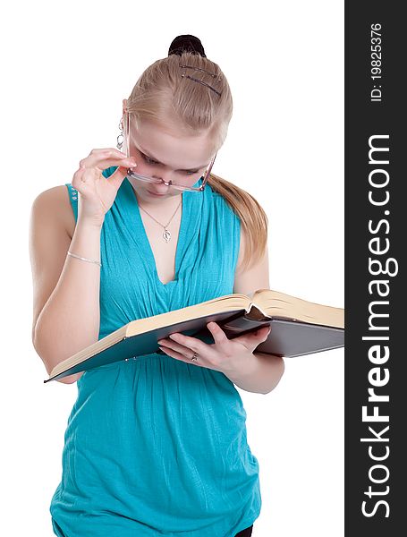 A young girl in glasses with a book isolated on