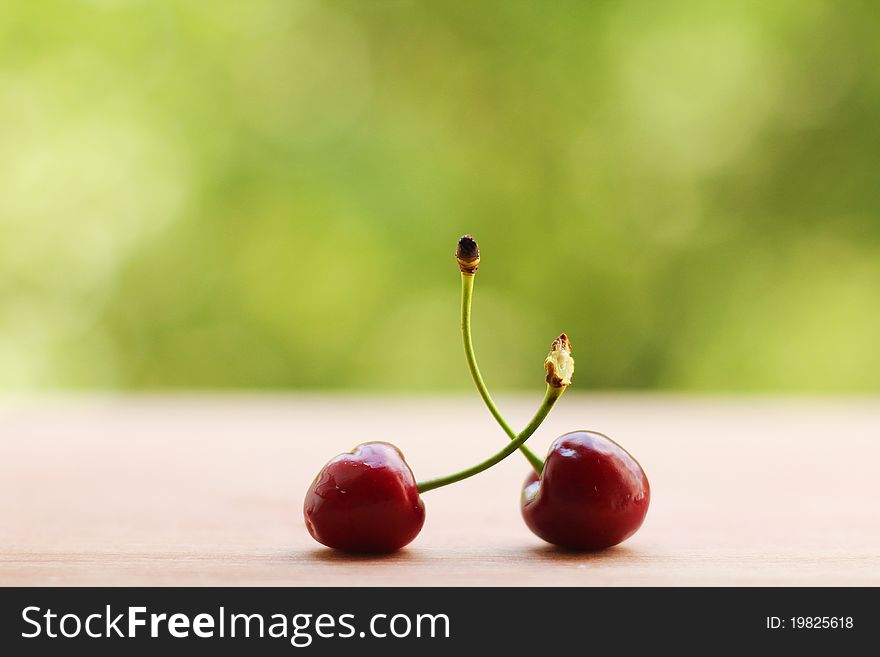 2 ripe cherry on the kitchen board