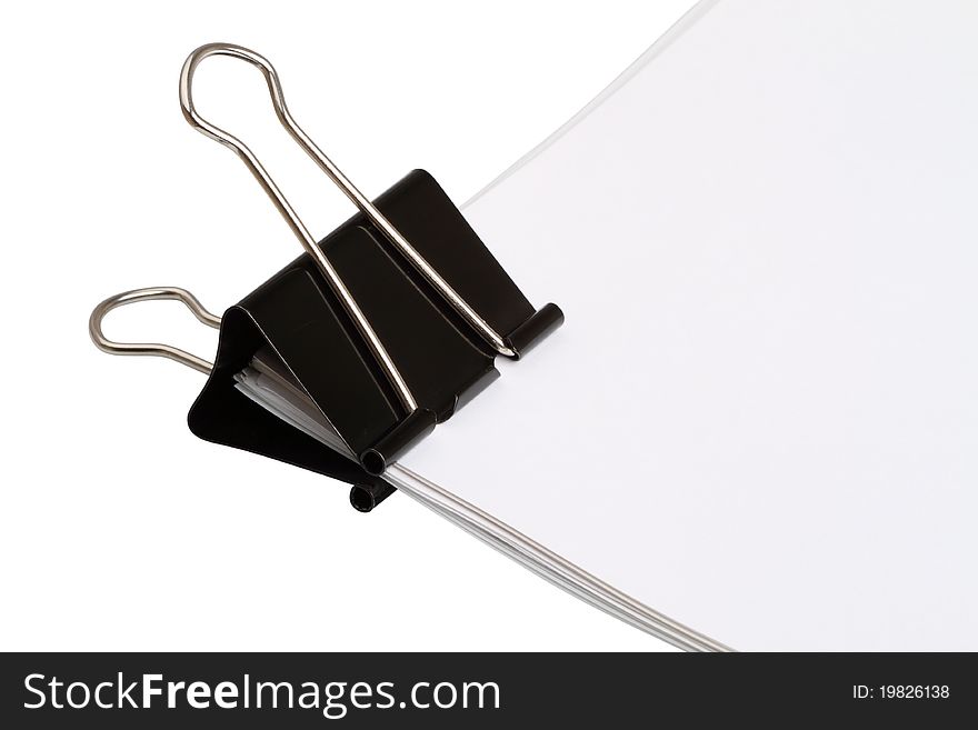 Large paper clip on blank papers isolated on white background