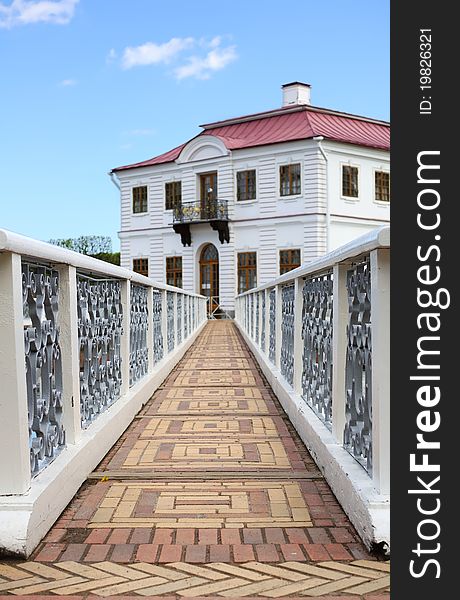 Old footbridge leading to the medieval mansion