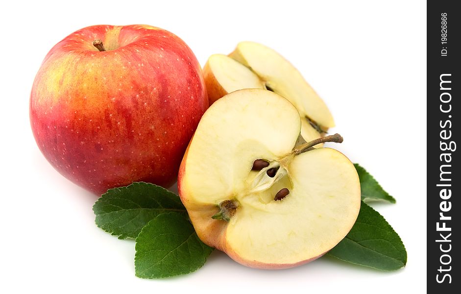 Juicy red apples with leaves on a white background