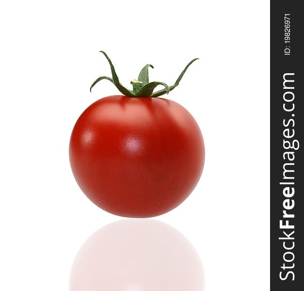 Juicy red tomato on the white background
