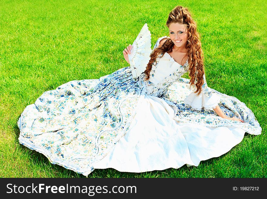 Beautiful young woman in medieval era dress on a sunny day outdoor. Beautiful young woman in medieval era dress on a sunny day outdoor.