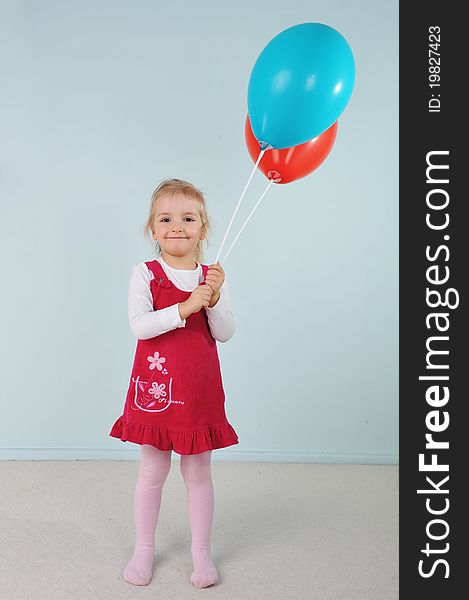 Beautiful little girl playing with balloons. Beautiful little girl playing with balloons