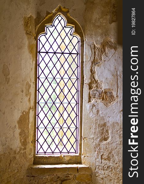 Abbey leaded glass windows in limestone walls. Abbey leaded glass windows in limestone walls