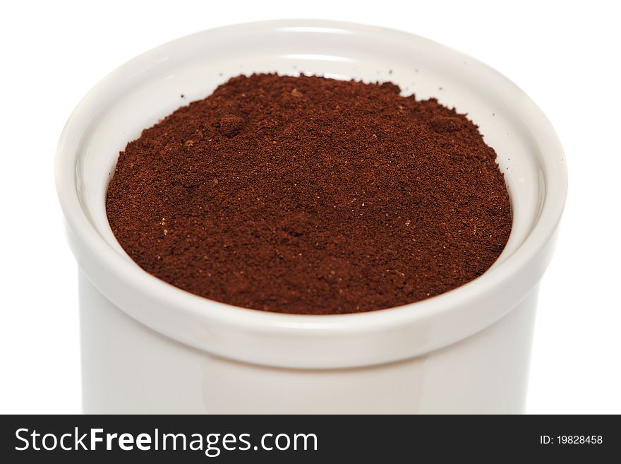 Ceramic jar with coffee grain isolated on white background