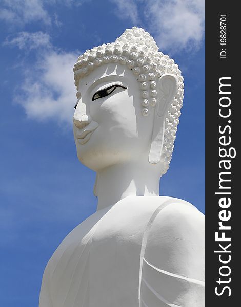 A statue of of a white Buddha in Thailand
