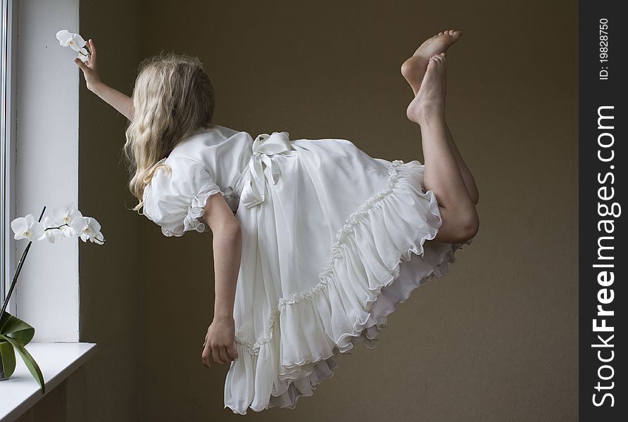 A young girl flying in the air. A young girl flying in the air