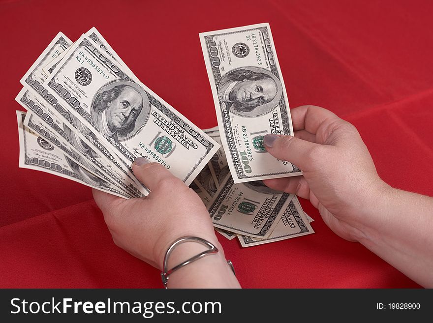 Hands and dollars on a red background. Hands and dollars on a red background