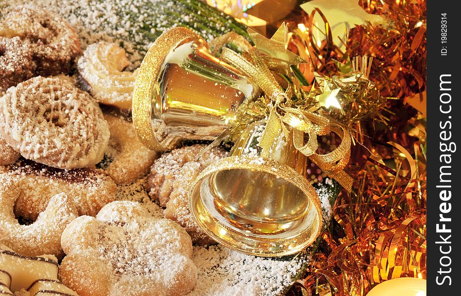 Christmas still life photo with cookies and golden bells. Christmas still life photo with cookies and golden bells