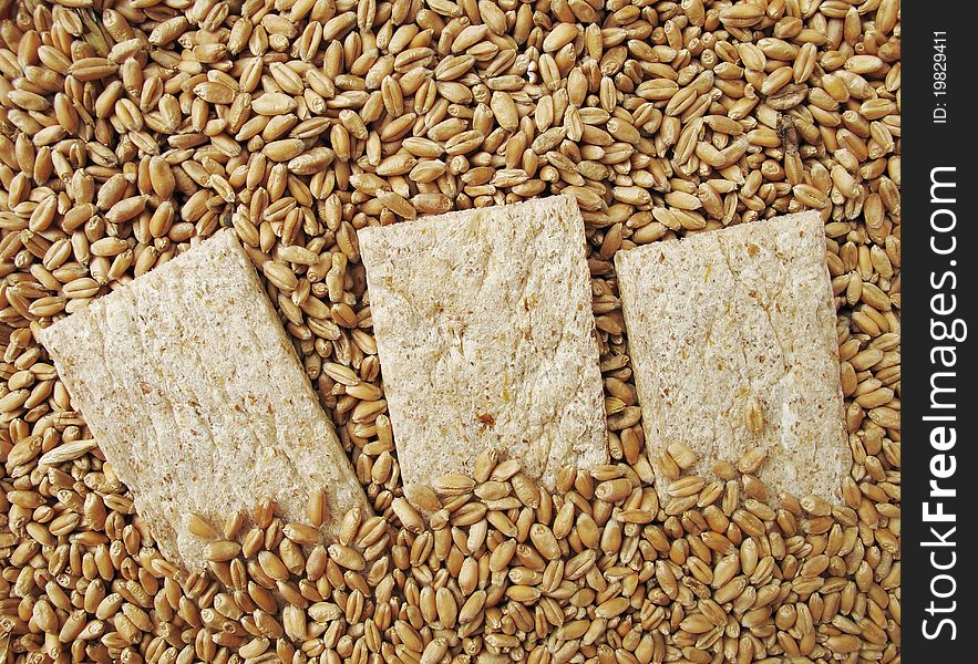 Small loaf (of bread), bread crisps and grains of wheat