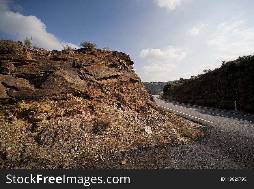 Pile of rocks along the asphalt road