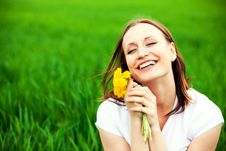 Woman With Dandelions Stock Images