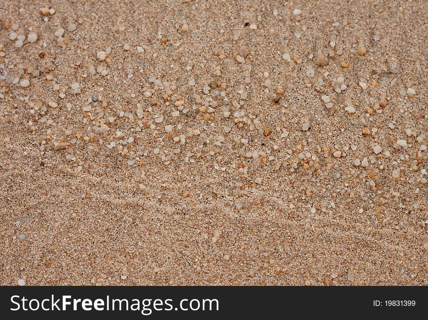 White pebble and brown sand on beach. White pebble and brown sand on beach