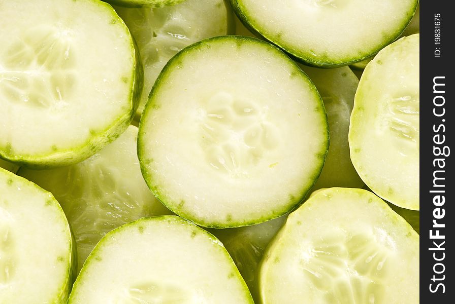 Cucumber slices layered in rows, overhead shot