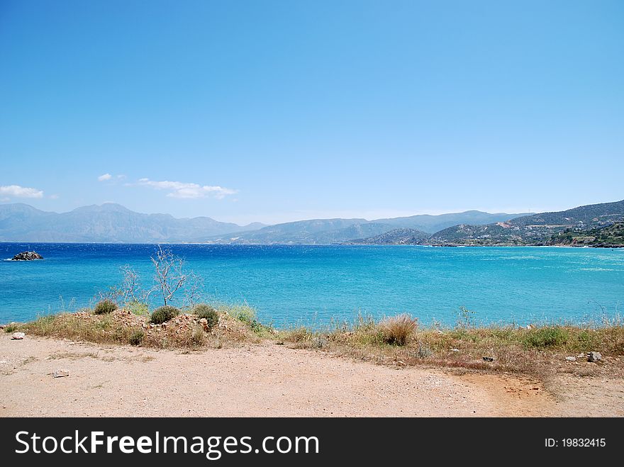 Cretan   light-blue sea  near city Agios Nikolaos. Cretan   light-blue sea  near city Agios Nikolaos